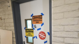 A picture of a door with construction signs at UUCP